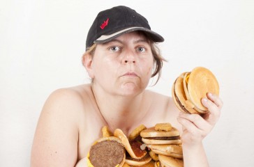 Katy Baird is centre photo, covered in hand burgers.