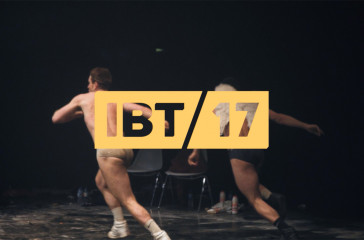 Two men about to leap on stage. With IBT17 logo.