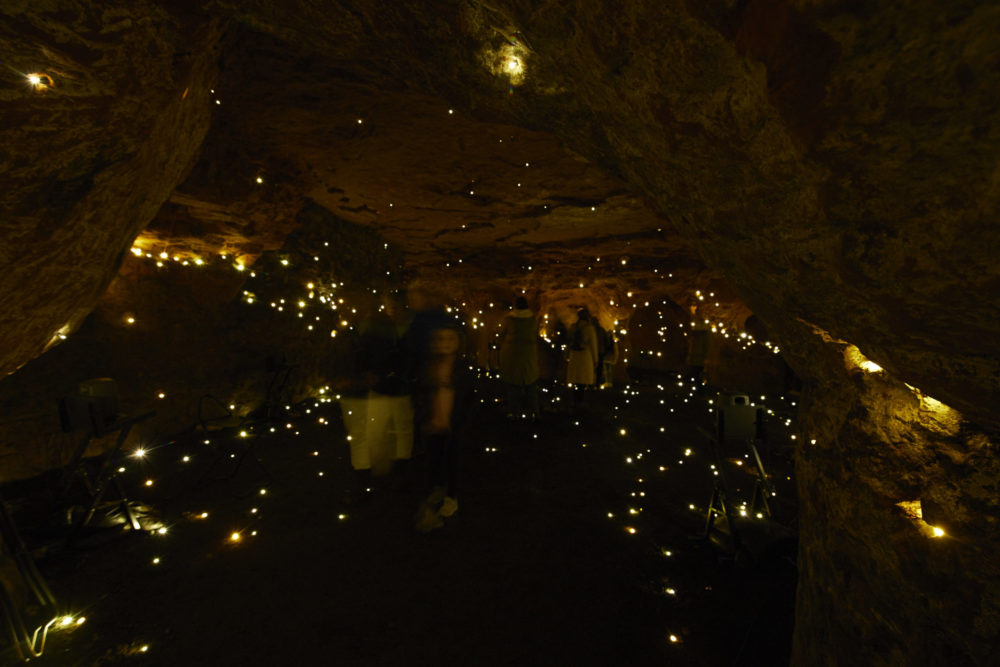 people explore the We Are Warriors installation in Redcliffe Caves